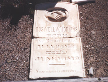 this headstone now lies broken on the ground