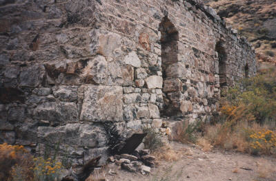 see our firepit at the base of the rock wall?